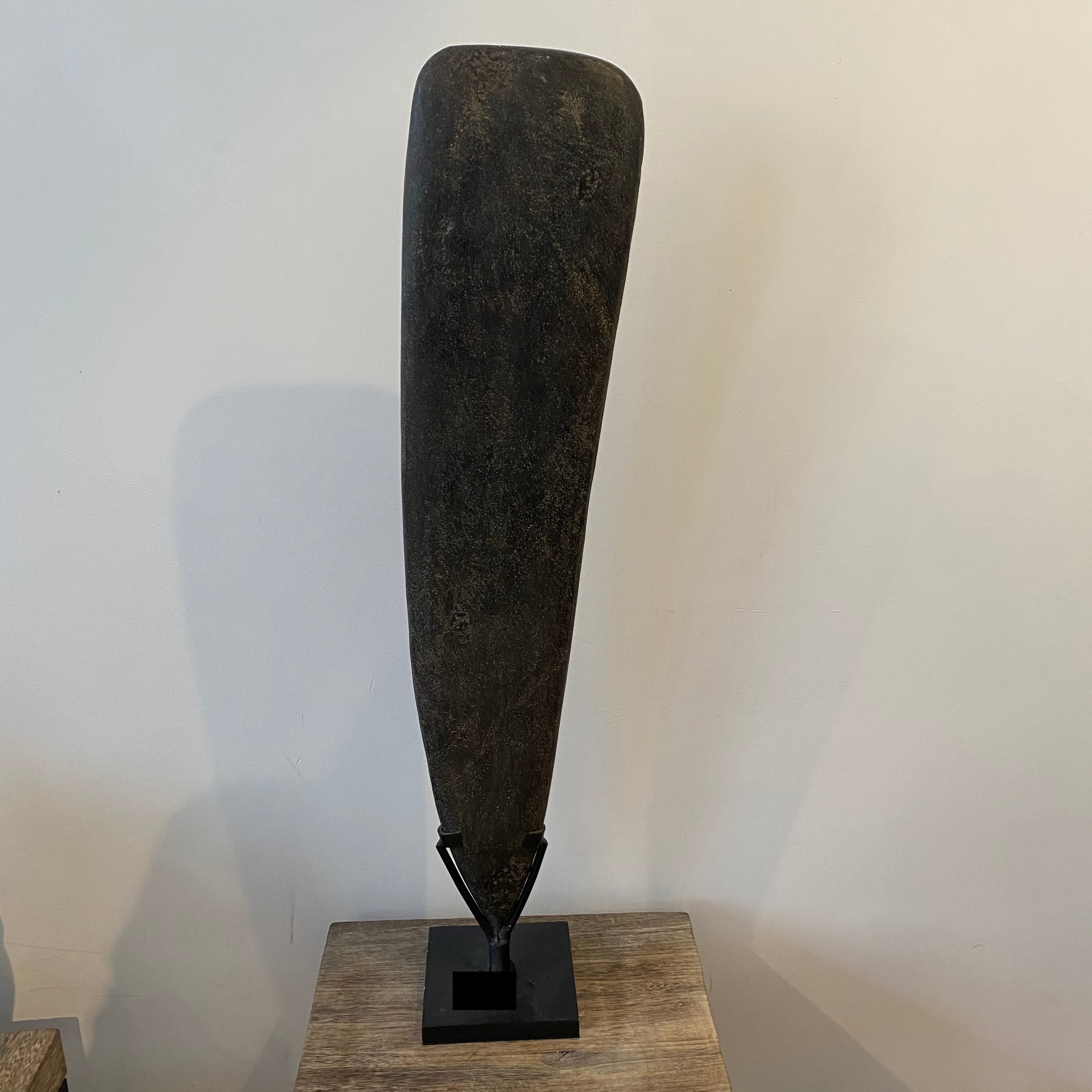 Papuan axe on broad stand
