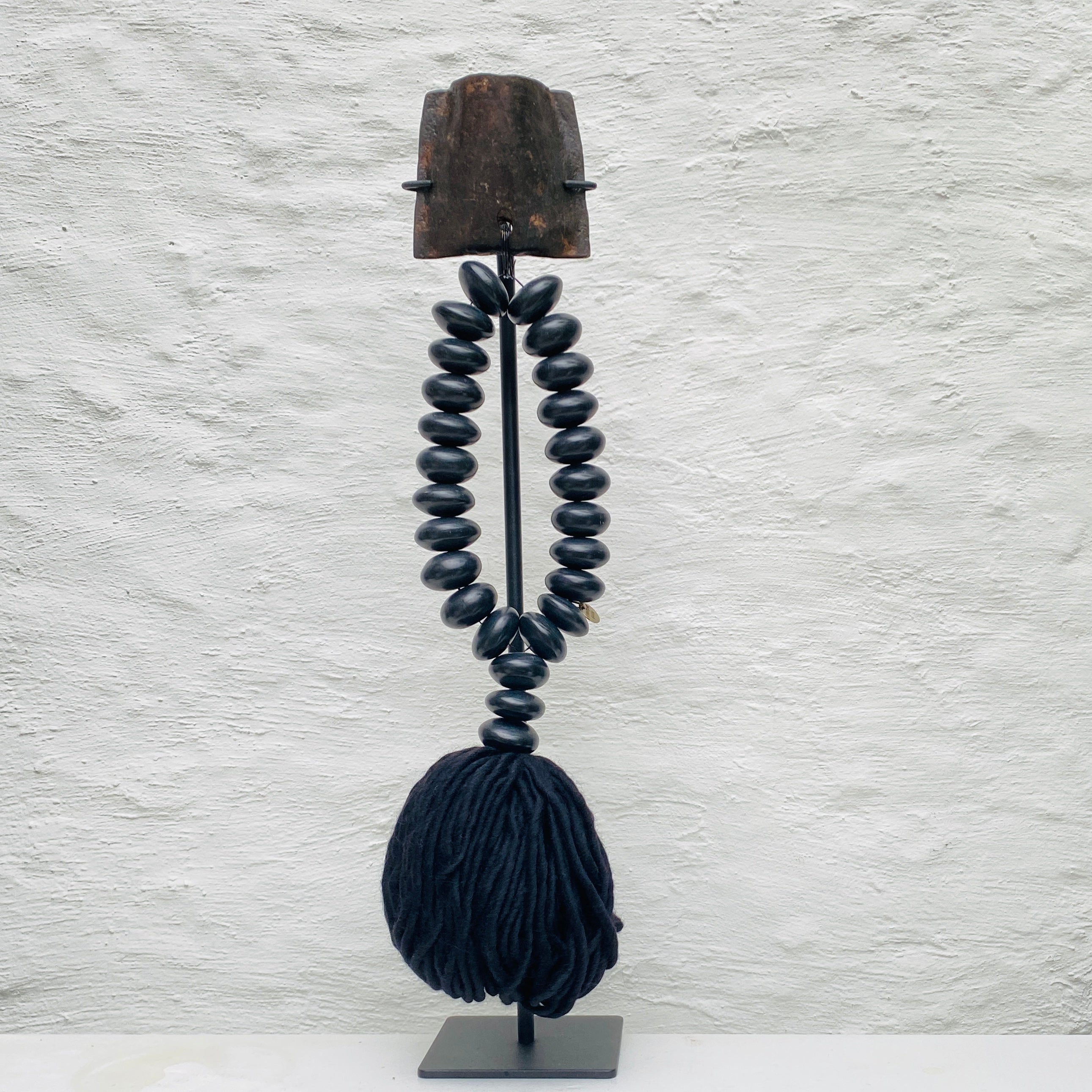 Studio Julia Atlas - Black amber manmade Africa, Iron cow bell, black alpaca wool tassel - Unique