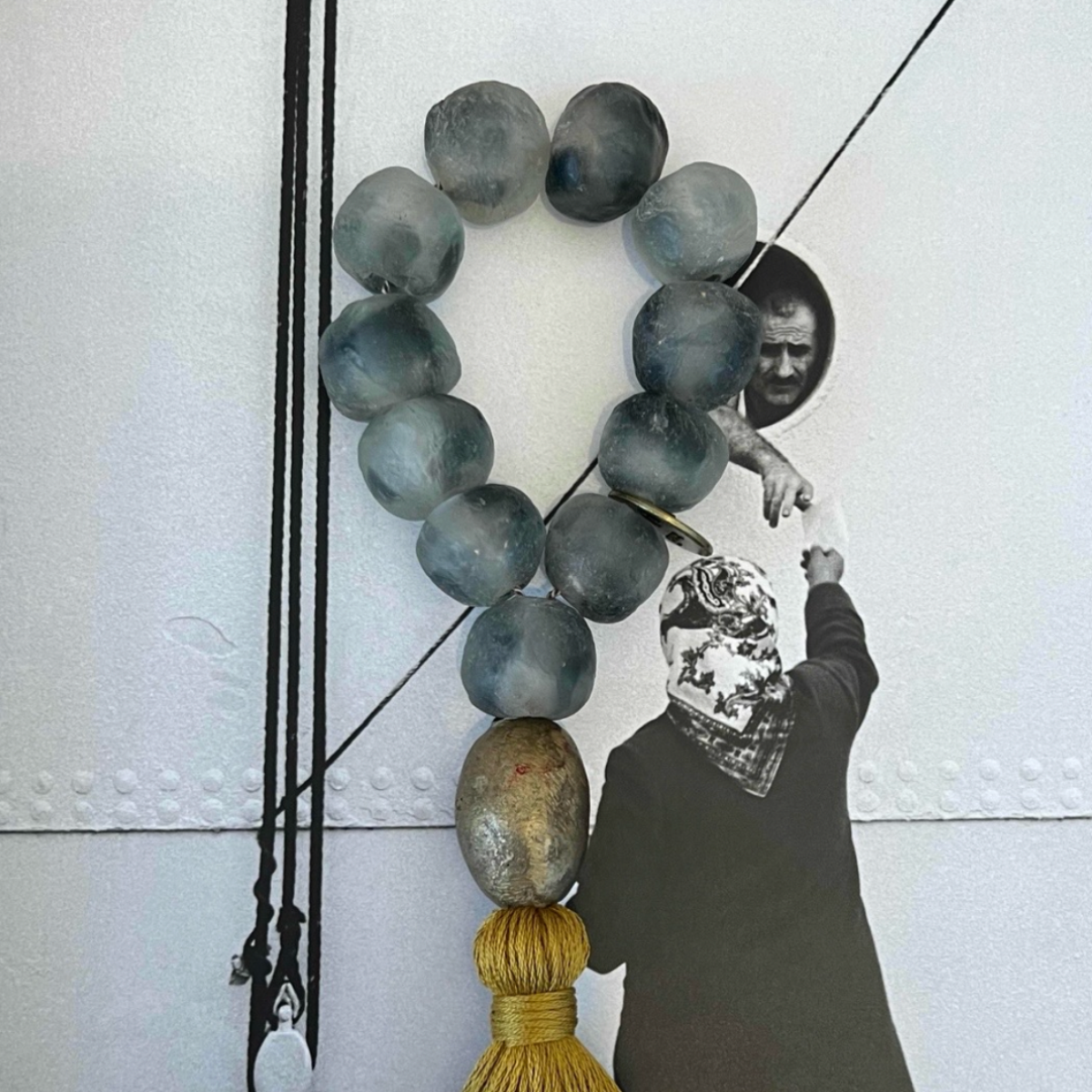Studio Julia Atlas - Ice grey recycled glass Ghana, bronze, cotton tassel - mini