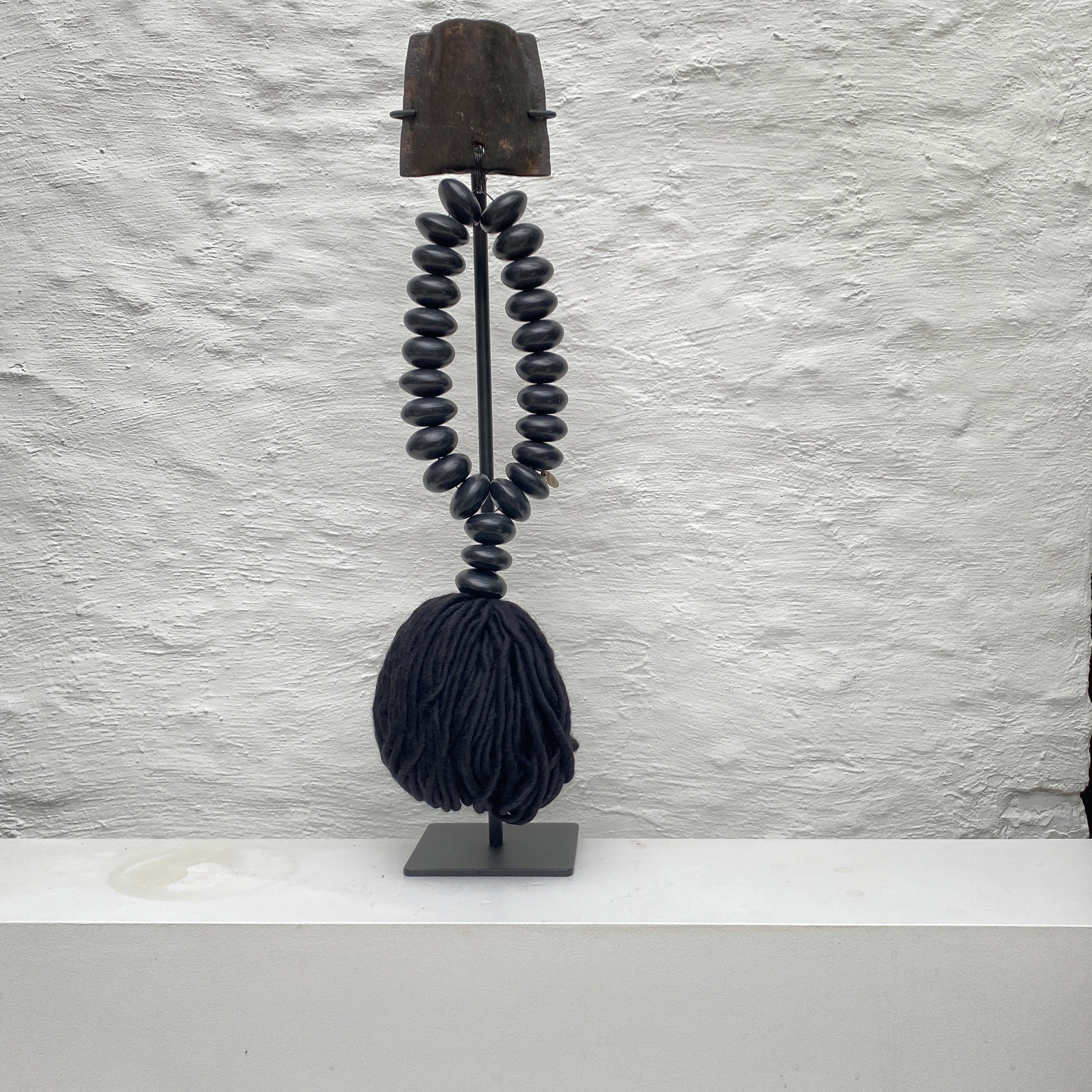 Studio Julia Atlas - Black amber manmade Africa, Iron cow bell, black alpaca wool tassel - Unique